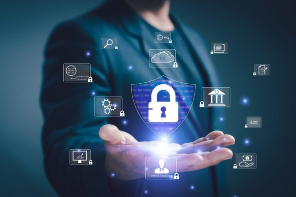 Concept protection of personal information security from cybercrime. Businessman hand show shield, key lock authentication, access personal financial data digital security cyber Online transactions.